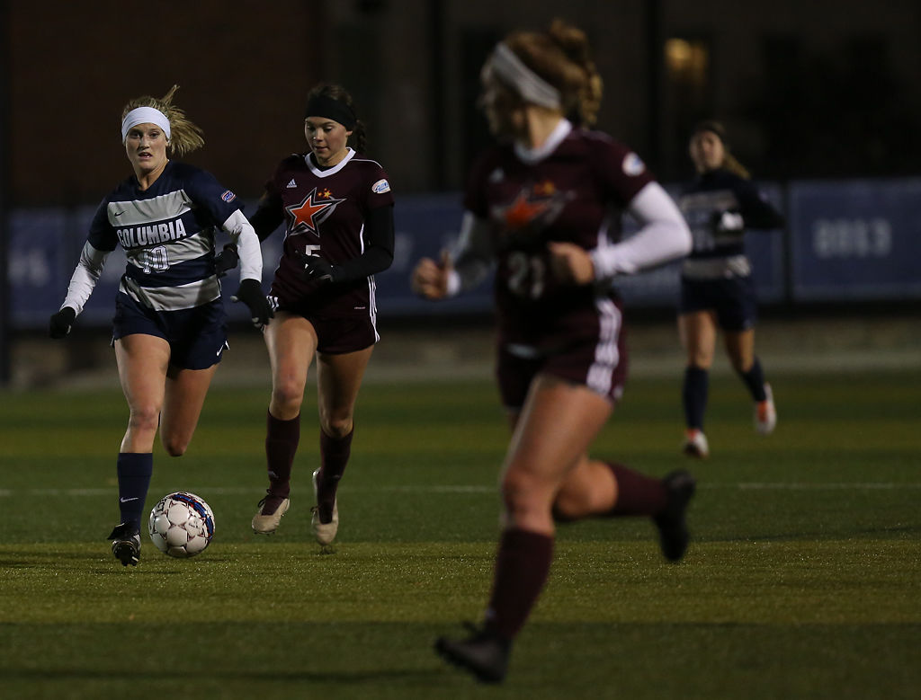 Molly Klein runs past Peyton Lane